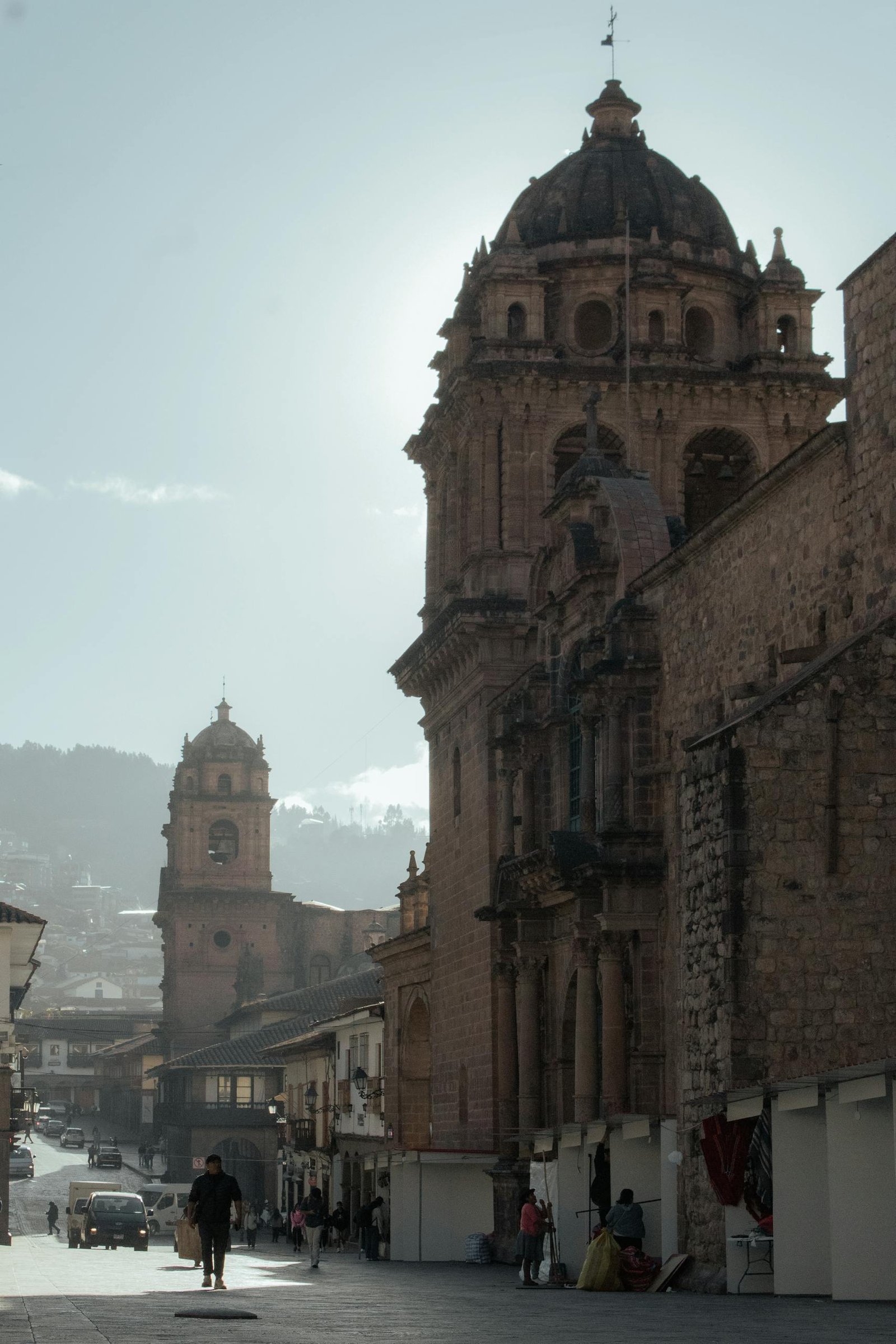 Capture of ancient stone architecture in Cusco, Peru, showcasing vibrant city life.